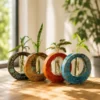 Hand-carved solid mango wood circular hydroponic planter with borosilicate glass test tubes and indoor plants for home and office décor.