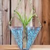 Handcrafted wooden wall hanging planter in a unique V-shaped design, perfect for adding a touch of nature-inspired elegance to your home decor. The planter features intricate carving details and a sturdy construction, providing a stylish and functional way to display your favorite indoor plants. Its artistic craftsmanship and natural wood finish effortlessly blend with various interior styles, bringing a refreshing and organic feel to any room."