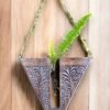 Handcrafted wooden wall hanging planter in a unique V-shaped design, perfect for adding a touch of nature-inspired elegance to your home decor. The planter features intricate carving details and a sturdy construction, providing a stylish and functional way to display your favorite indoor plants. Its artistic craftsmanship and natural wood finish effortlessly blend with various interior styles, bringing a refreshing and organic feel to any room."