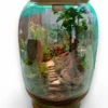 Bell Jar Bonsai Terrarium from Wildroots with a miniature bonsai tree inside a clear glass dome for stylish indoor plant decor.