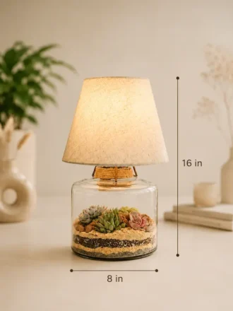Glass lamp terrarium with succulent plants and fabric lampshade decorative indoor table lamp for modern home décor.