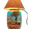 Bell jar lamp terrarium with plants and moss by Wildroots.