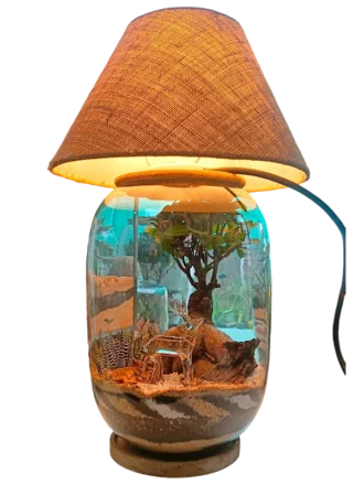 Bell jar lamp terrarium with plants and moss by Wildroots.