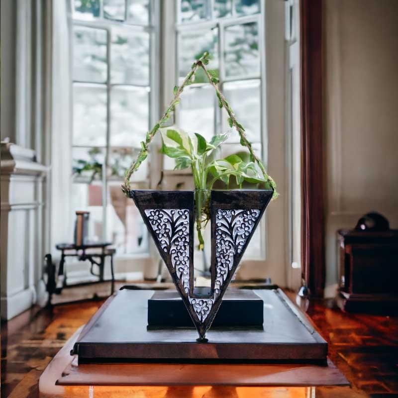 Handcrafted wooden wall hanging planter in a unique V-shaped design, perfect for adding a touch of nature-inspired elegance to your home decor. The planter features intricate carving details and a sturdy construction, providing a stylish and functional way to display your favorite indoor plants. Its artistic craftsmanship and natural wood finish effortlessly blend with various interior styles, bringing a refreshing and organic feel to any room."